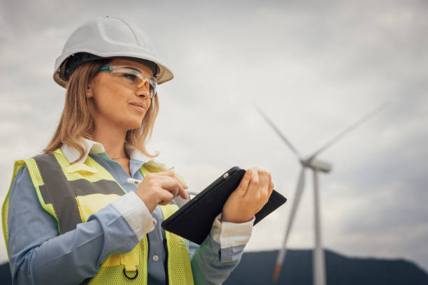 istock An experienced female engineer is inspecting a wind turbine site, using her tablet to assess the equipments functionality and ensure compliance with strict sustainability standards 2191741267