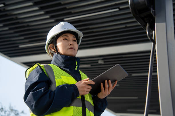 istock asian female engineer working with digital tablet in charging station 2191742407