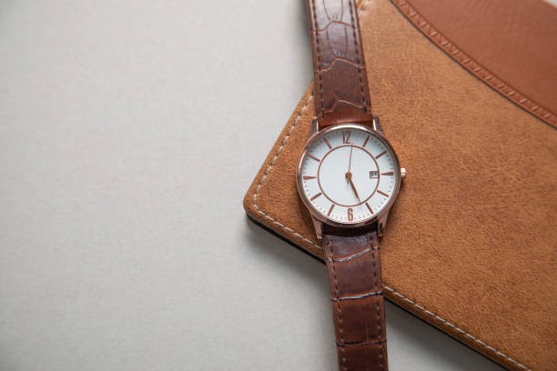 istock Brown elegant wristwatch with a notepad. 2191743186