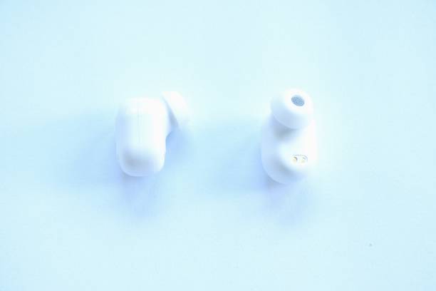 istock wireless earphone for conecting with mobile phone on white background 2191745583