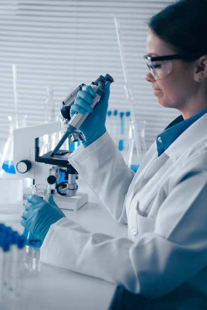 istock A dedicated scientist is in the laboratory, meticulously conducting detailed research using a highpowered microscope to explore various scientific phenomena and push the boundaries of knowledge 2191746390