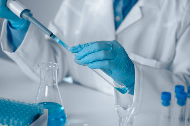 istock A Laboratory Technician is currently engaged in conducting a detailed experiment using a pipette within a modern laboratory environment, illustrating key themes in scientific research and safety 2191747249