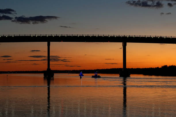 Boats under the Surf City Bridge in North Carolina at Sunset
