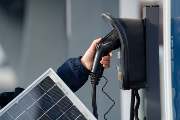 istock asian female engineer holding solar panel in charing station 2191747704