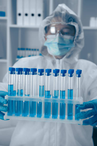 istock A Laboratory Technician skillfully analyzing a variety of test tubes filled with vibrant blue solutions, contributing to critical research in the fields of biotechnology and healthcare 2191752496