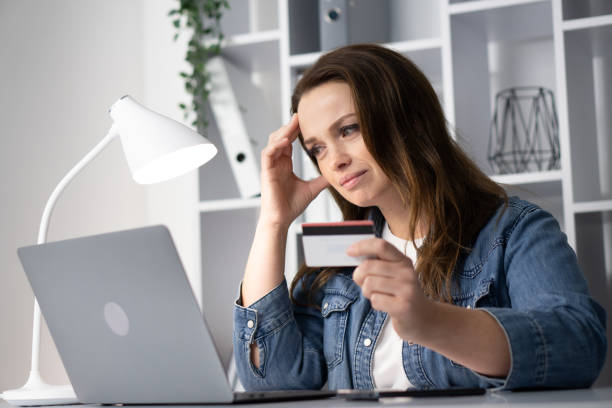 istock A Stressed Woman Engaging in Online Shopping and Comparing Multiple Options Thoughtfully on Her Laptop While Undergoing Moments of Contemplation and Introspection Facing Modern Technology 2191754173