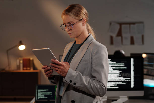 istock Blond young businesswoman with tablet 2191755384