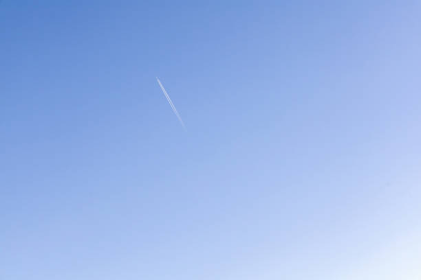 istock A single jet plane flying on the beautiful blue sky 2191757406