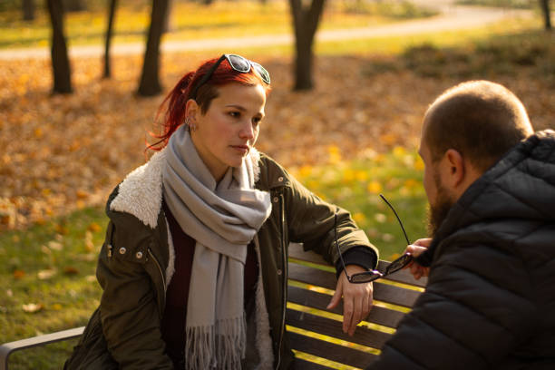 emotional conversation in autumn park