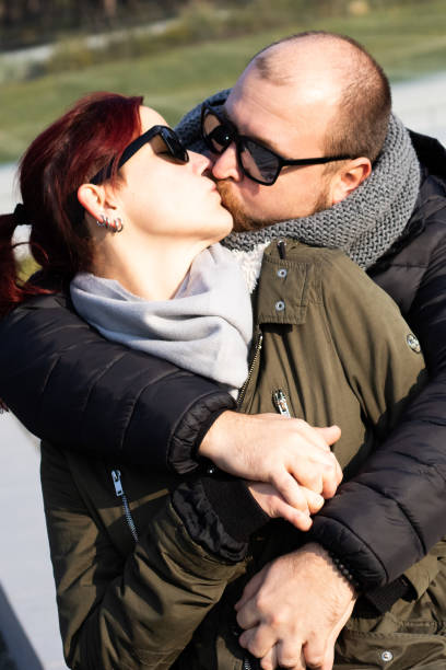 Young adults kissing at a house party in latin america