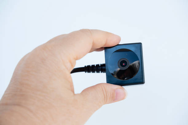istock Hand gripping small security camera, emphasizing portability and convenience, discreet monitoring in any setting, video surveillance 2191758789