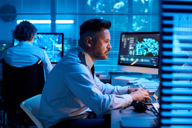 istock Man looking at laptop screen and typing 2191760272