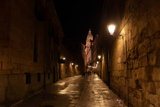 Salamanca, Spain - 10 January 2021: Narrow streets of medieval Salamanca by night