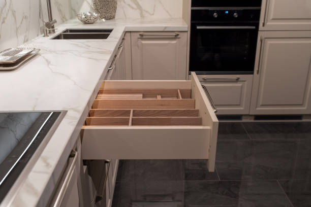 Opened wooden drawer organizer in classic kitchen