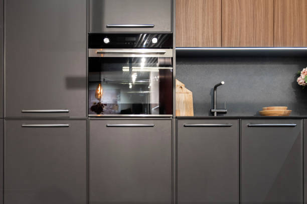 istock Contemporary kitchen showcases elegant cabinets, an oven, and minimalist decor 2191762634