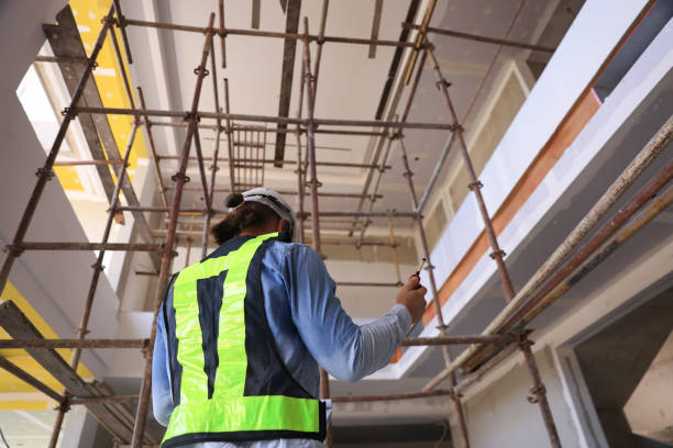 istock Engineering man site construction work. The project manager supervises the progress of the blueprint at a construction site 2191768458