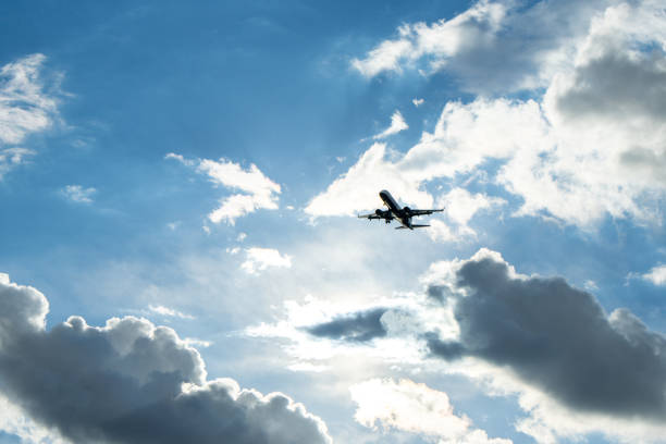 A passenger aircraft passing overhead as it either comes into land or has just taken off from an airport.