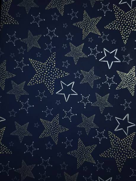 Christmas stars shining on dark blue background, festive holiday pattern Gift boxes New Year preparation decor