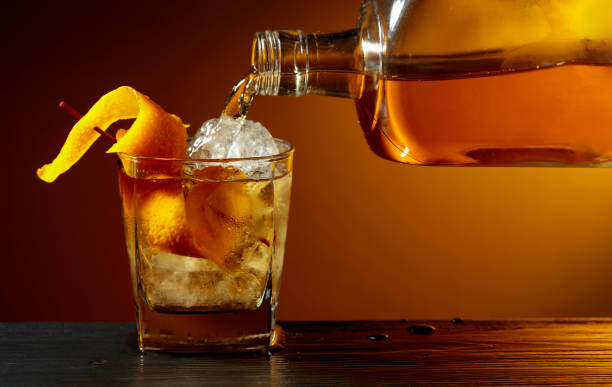 istock Old-fashioned cocktail classic bourbon whiskey and bitters, garnished with orange peel. 2191778265
