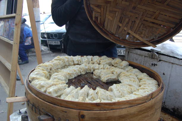 Manti is a type of dumpling one of kazakh traditional meals. The image shows a typical steam pot with damped Mantis.