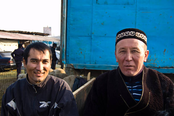 Two kazakh men at an animal market in Almaty City. Captured during summer season.