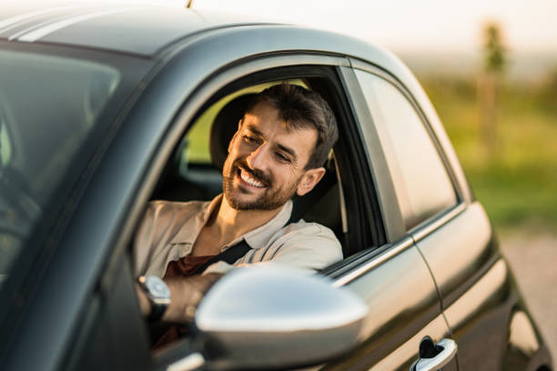 istock Happy man driving his car and having fun 2191782034