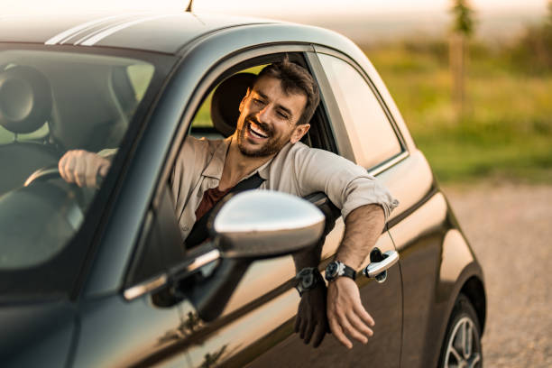 istock Happy man driving his car and having fun 2191782070