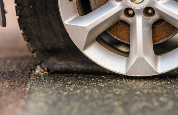 istock Badly damaged car rim and tyre.. 2191783678