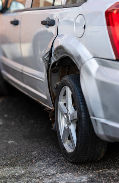 istock Damaged rear wheel arch of a silver car.. 2191783713
