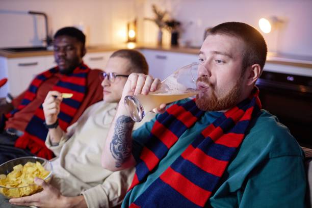 istock Sports Fan Drinking Beer at Home 2191783949