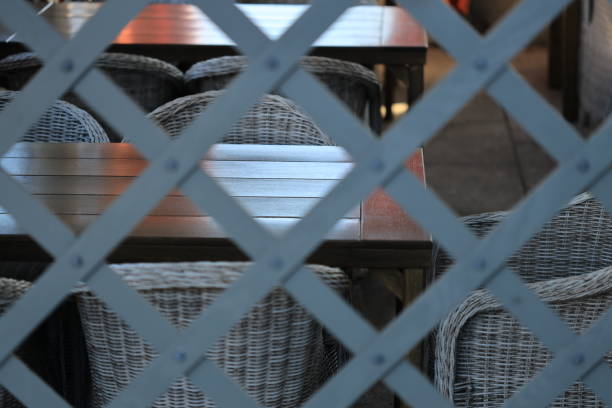 A cozy dining setting with a wooden table and wicker chairs.