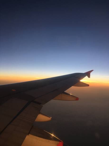 istock Airplane wing on the sunset 2191788226