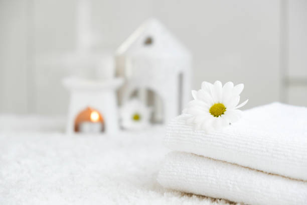 istock White towels with chamomile flower and aroma lamp 2191788246