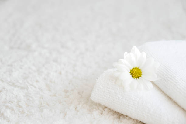 istock White towels with chamomile flower and aroma lamp 2191788247
