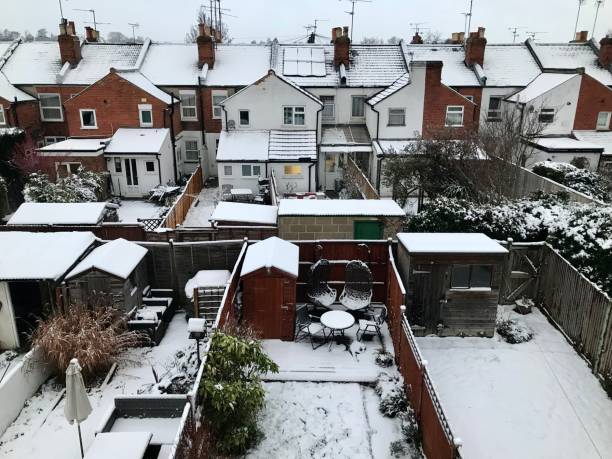 istock Snow covered terraced house back gardens 2191790178