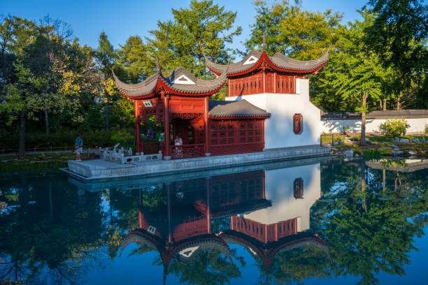 Montreal, Canada - September 29, 2024. Tourists at pavilion in Chinese Garden at Montreal Botanic Garden, Montreal, Quebec, Canada