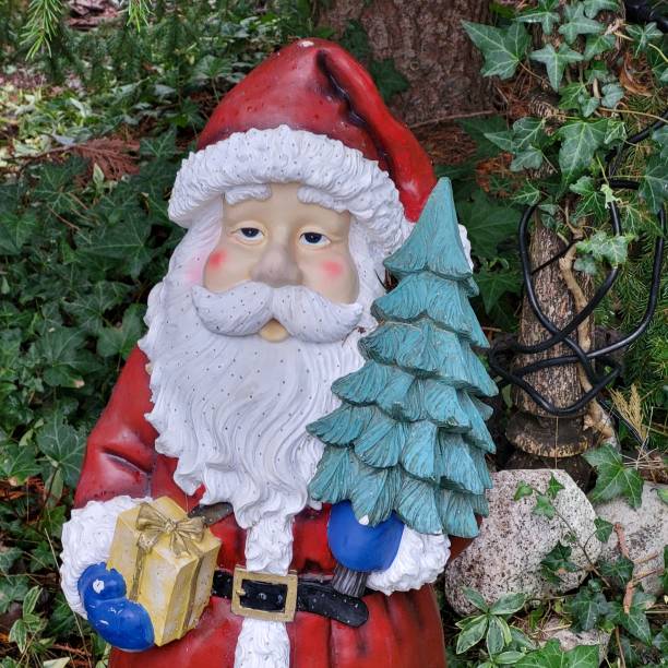 istock Vintage Santa garden statue on display in a front yard garden 2191792045