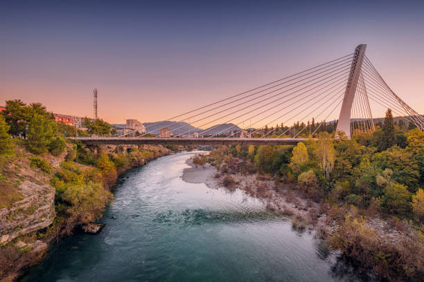 istock Millennium Bridge in Podgorica at sunset, spanning the Moraca River, offering a stunning view of the cityscape and a perfect urban landmark for travelers. 2191795038