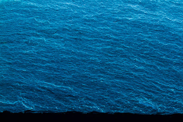 istock Vivid blue textured slab against a blue background. Modern abstract design. 2191801284