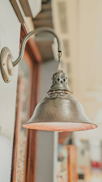 istock Low angle view. An antique lamp on the wall 2191801350