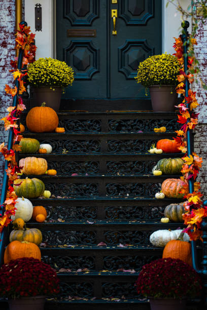 istock Halloween pumpkin decorations. Pumpkin for decorated house. Halloween Decorated at front yard of a American home. Halloween decorated front door with pumpkins. Autumn holiday of Halloween. 2191802336