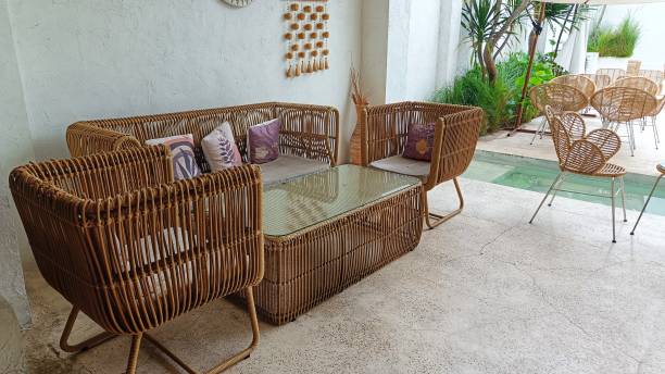 istock Cafe atmosphere with tables and relaxing sofa chairs made from rattan 2191803604