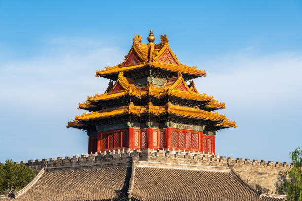 Beijing, China- 2 Nov 2024: Forbidden City Corner Tower, or Jiaolou tower and river in the misty day. It is a landmark in Beijing, China