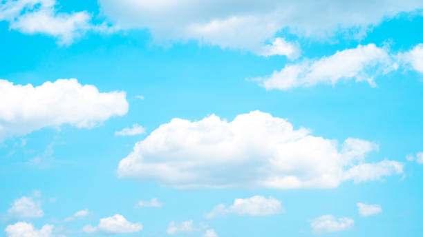 istock A scenic sky with scattered white clouds set against a bright blue background, ideal for evoking peace and inspiration. 2191805509