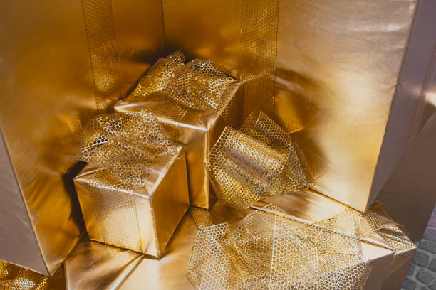 istock gold wrapped gifts 2191812261