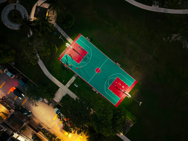 istock basketball court at night illuminated with spotlit 2191815899