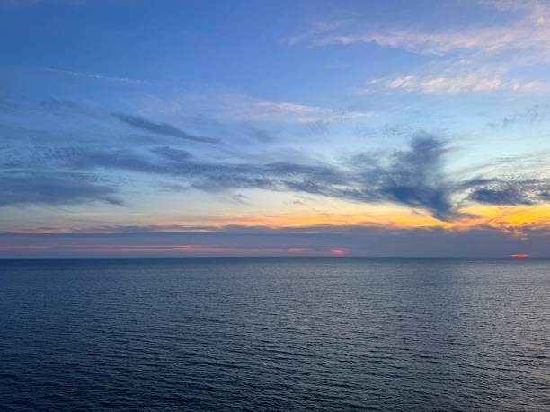 istock Dusk sky over calm blue sea. 2191815944