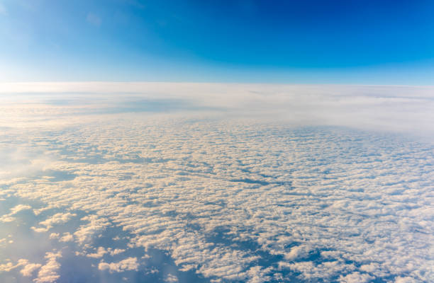 istock View from the airplane window at a beautiful cloudy sky and the airplane wing 2191816228