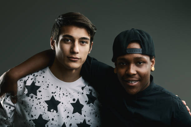 istock Two young men embracing friendship and expressing their style 2191816412