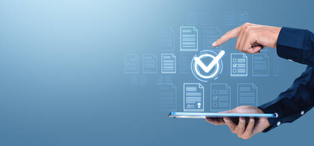istock Man finger touch check mark, digital documents and files hologram. Copy space 2191822963